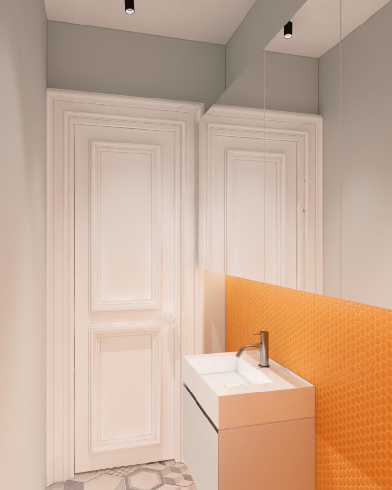 Необычное сочетание серых стен и оранжевой плитки в пространстве санузла создаёт атмосферу радости.